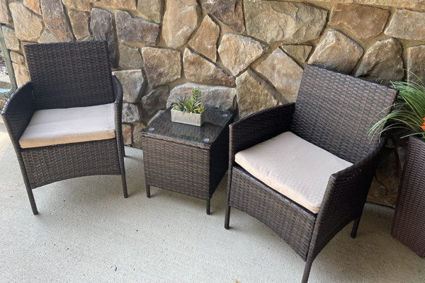 Muebles de terraza de ratán con cojines de asiento